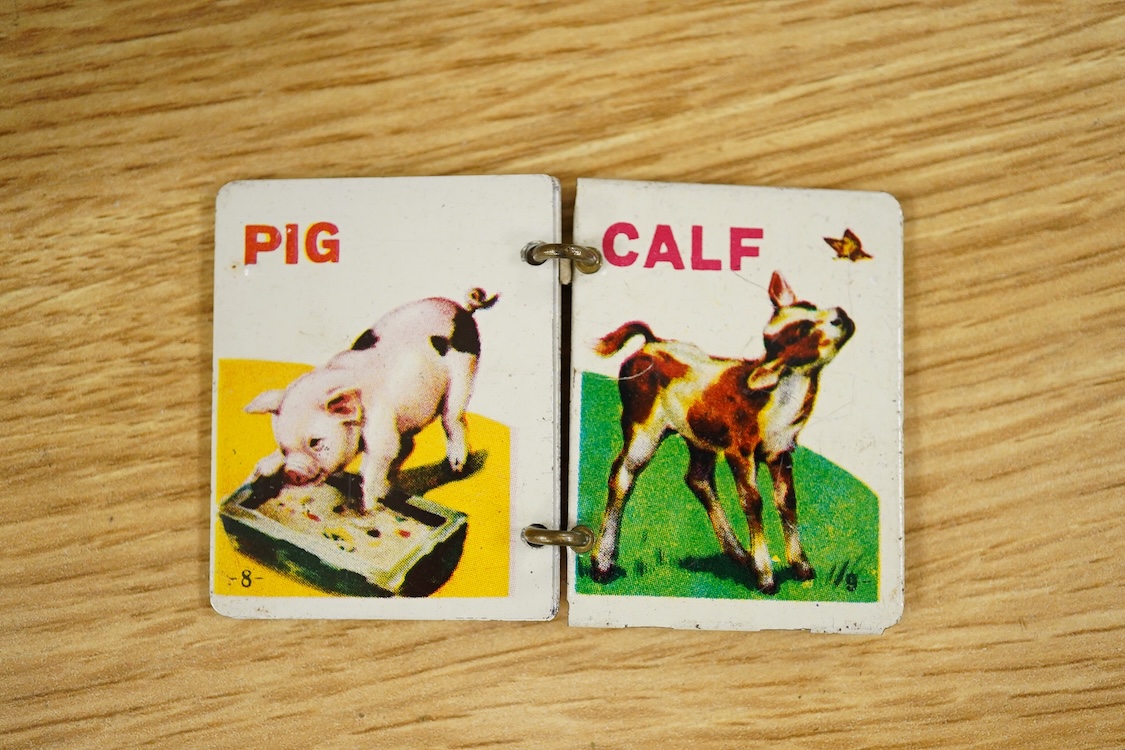 Three boxed clockwork tinplate toys - a 1960s Japanese Cubby the Reading Bear, by Alps (Japan), 17cm high, a USSR doll, and a later ‘Roli Zoli’ clown on a scooter (3)